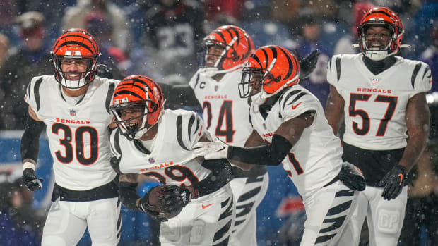 The Bengals defense celebrates as Cincinnati Bengals cornerback Cam Taylor-Britt (29) comes down with an interception to seal the game in the fourth quarter of the NFL divisional playoff football game between the Cincinnati Bengals and the Buffalo Bills, Sunday, Jan. 22, 2023, at Highmark Stadium in Orchard Park, N.Y. The Bengals won 27-10 to advance to the AFC Championship game against the Kansas City Chiefs. Cincinnati Bengals At Buffalo Bills Afc Divisional Jan 22 165